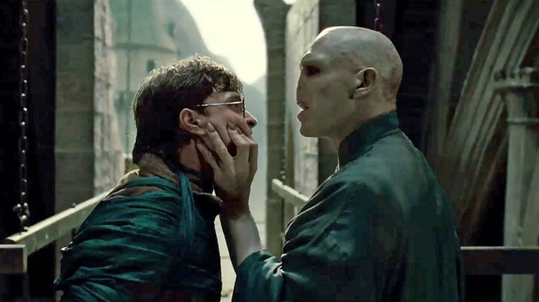 Voldemort grabbing Harry by the face in Harry Potter and the Deathly Hallows: Part 2