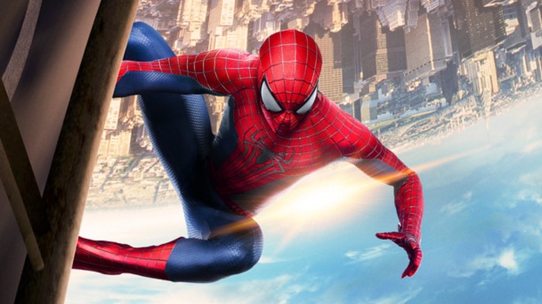 The Amazing Spider-Man 2 - Spider-Man clinging off of Oscorp building with upside down NYC skyline in background