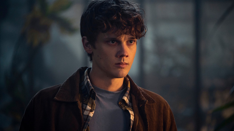 Wednesday Tyler standing and staring