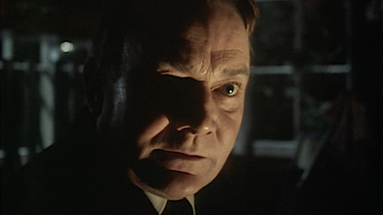 Denholm Elliott as the haunted title character in The Signalman