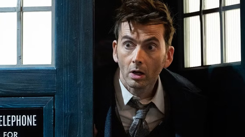 The Doctor peeking out from the TARDIS on Doctor Who