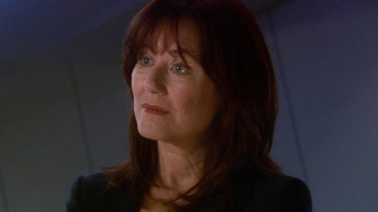 Mary McDonnell as President Laura Roslin listening attentively in Battlestar Galactica