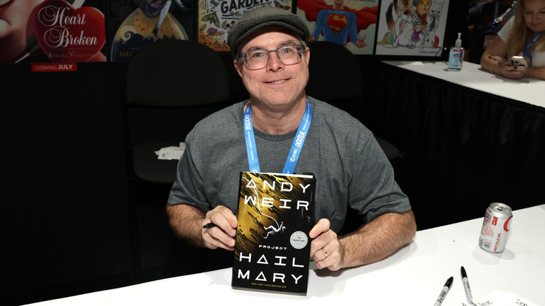 Andy Weir holding copy of Project: Hail Mary