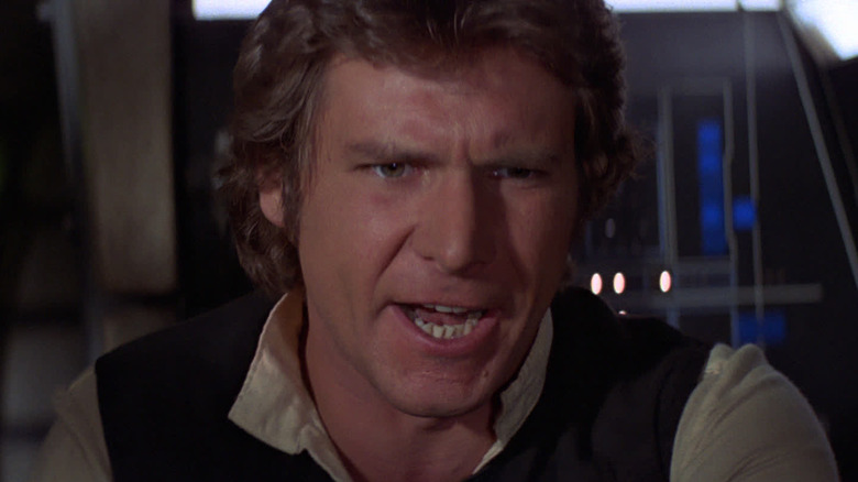 Harrison Ford as Han Solo in the cockpit of the Millennium Falcon in Star Wars: A New Hope
