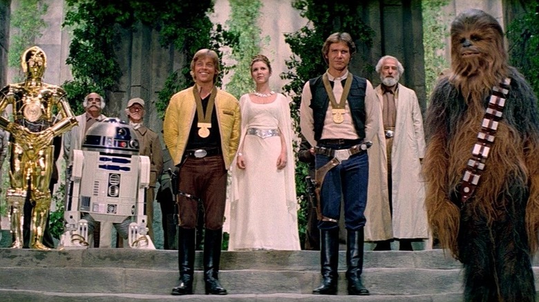 Luke, Han, Leia, and Chewbacca at the medal ceremony after the destruction of the Death Star in Star Wars: A New Hope