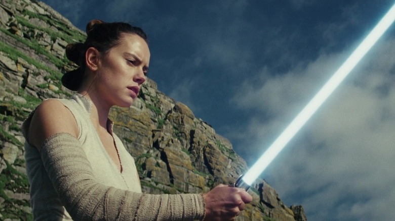 Rey wields lightsaber in The Last Jedi (2017)