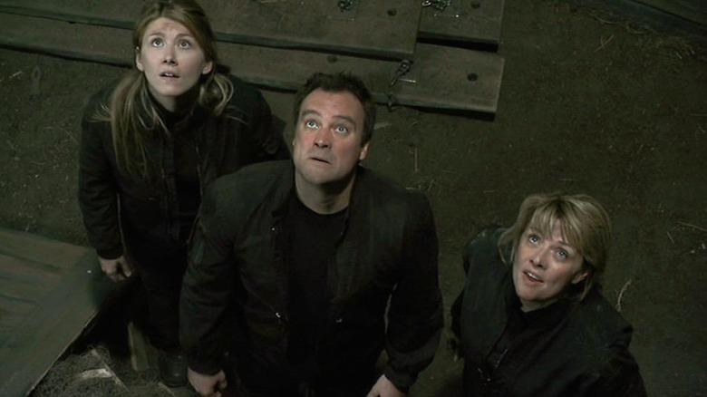 Keller, McKay, and Carter try to find a way out of the boxed room in Stargate Atlantis