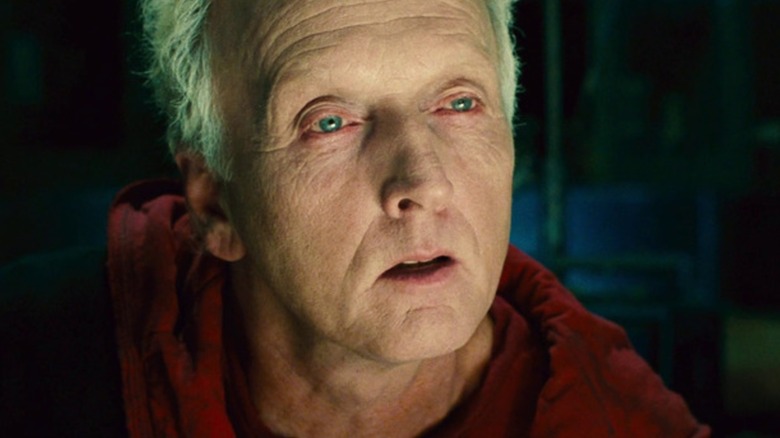 Tobin Bell's John Kramer looks amused despite being cornered at the end of Saw II