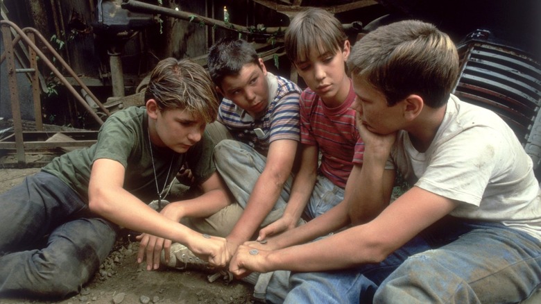 Our four protagonists make a pact in Stand By Me