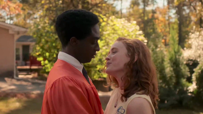 Caleb McLaughlin's Jacob and Sadie Sink's Max standing close to each other on Stranger Things