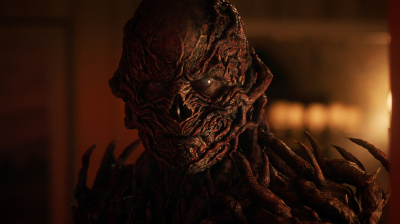 A close up of Vecna in a dimly lit room in Stranger Things season 5