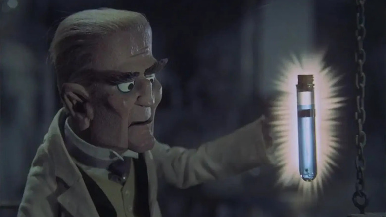 Baron Boris von Frankenstein holding a glowing vial in Mad Monster Party?