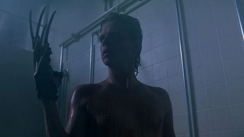 Jesse tries the glove on for size in A Nightmare on Elm Street 2: Freddy's Revenge