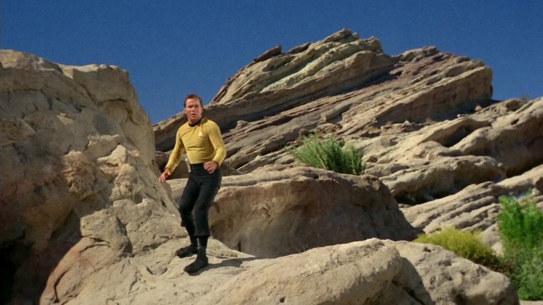 Kirk standing on Vasquez Rocks on Star Trek