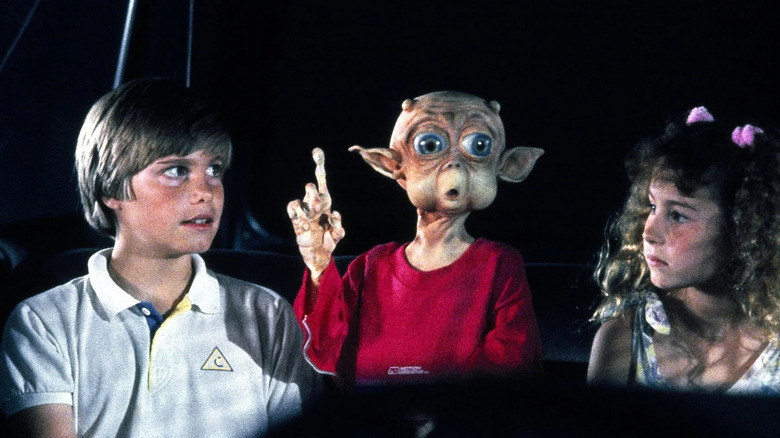 Eric, Mac, and Debbie in a car in Mac and Me