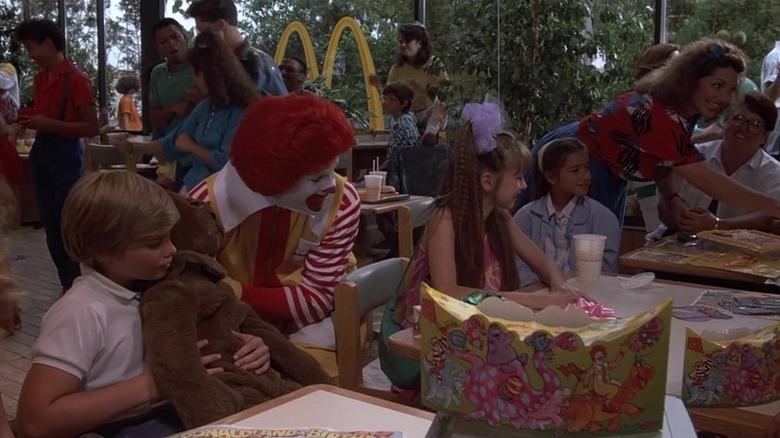 Ronald McDoland and Eric wheeling up to a table in Mac and Me