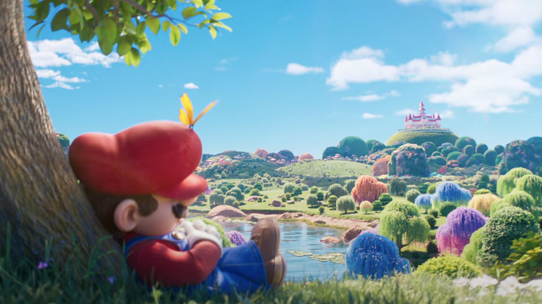 Mario sleeping outside with a butterfly resting on his hat in The Super Mario Galaxy Movie teaser