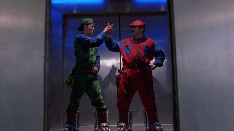 The Mario brothers wear suits and hats in the elevator in Super Mario Bros.