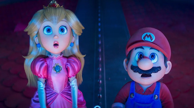 Peach and Mario looking up at something scared in The Super Mario Galaxy Movie