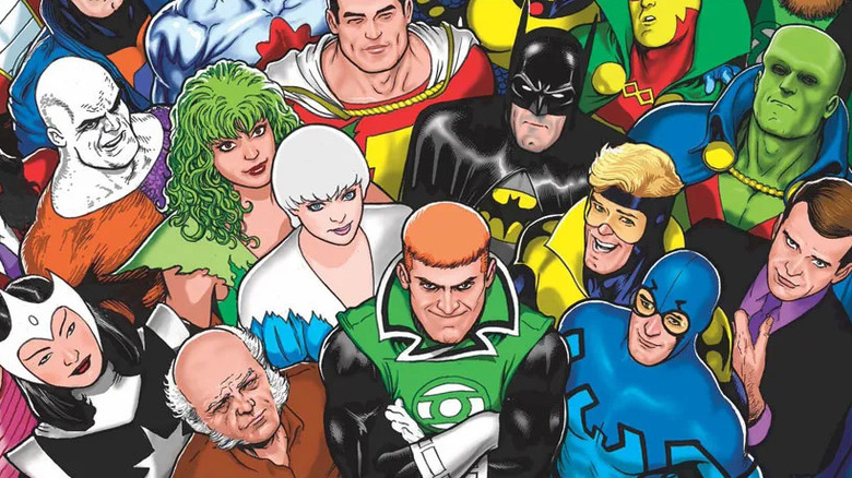 Foto de grupo da Liga da Justiça Internacional: Batman, Fogo, Gelo, Metamorfo, Besouro Azul, Booster Gold, Senhor Milagre, Doutor Luz, Batman, Guy Gardner, Maxwell Lord