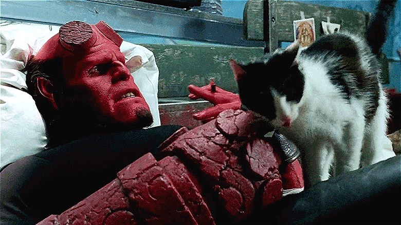 Hellboy pets a kitty