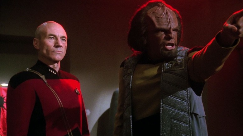 Worf pointing accusitorily with Picard behind him on Star Trek: The Next Generation