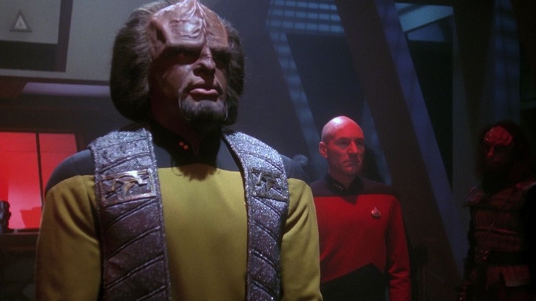 Worf in Klingon vestments with Picard behind him on Star Trek: The Next Generation