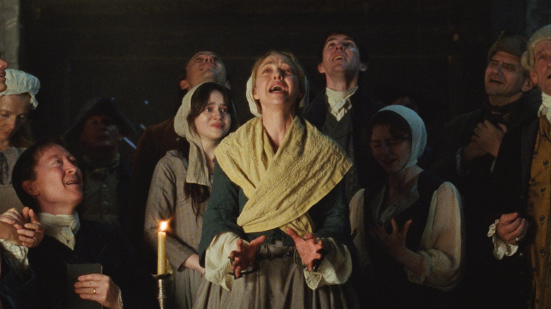 Ann crying around her followers in The Testament of Ann Lee