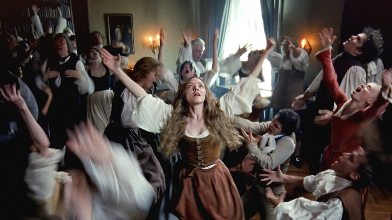 Ann Lee singing and dancing with a crowd of worshippers in The Testament of Ann Lee