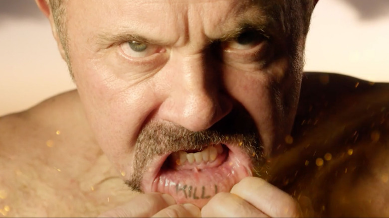 Kane Hodder shows off his lip ink in To Hell and Back: The Kane Hodder Story