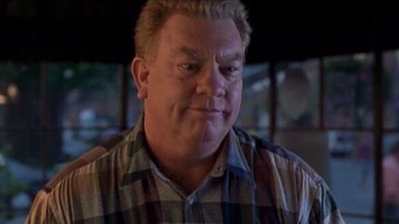 Charles Hallahan as Dr. Dreyfus looking serious in Dante's Peak