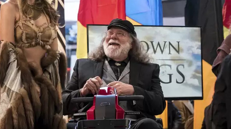 Richard Masur as Edward L.L. Moore, enjoying a convention, on Younger