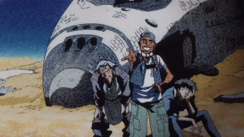 A photo of Doohan, Miles, and Spike sitting by a crashed space shuttle in Cowboy Bebop