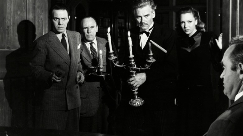The island guests gathering around in And Then There Were None