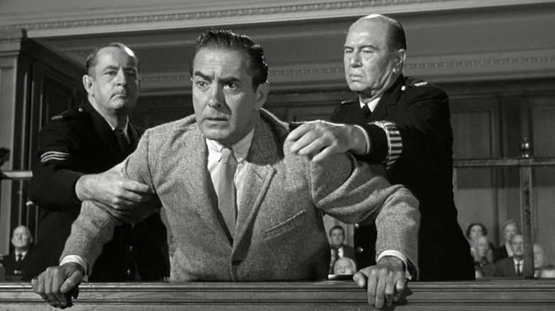 Courtroom officials holding back Leonard in Witness for the Prosecution