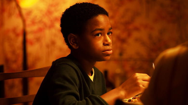 Blake Cameron James' Will Hanlon looks up as he eats at the dinner table in It Welcome to Derry