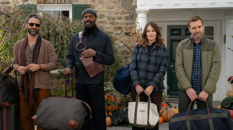 Claude Danny Kate and Jack waiting outside of a house with their luggage in The Four Seasons