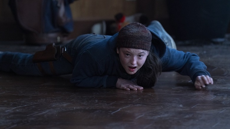 Ellie hysterically crying and screaming while pinned to the floor on The Last of Us