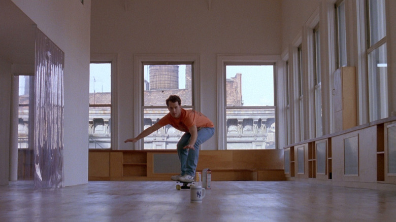 Josh skateboarding around an empty apartment in Big