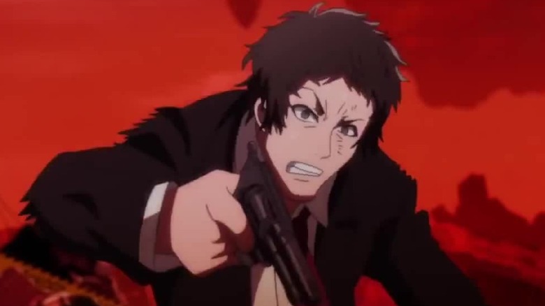 Adachi brandishing a gun