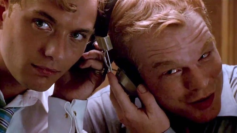 Philip Seymour Hoffman and Jude Law listening