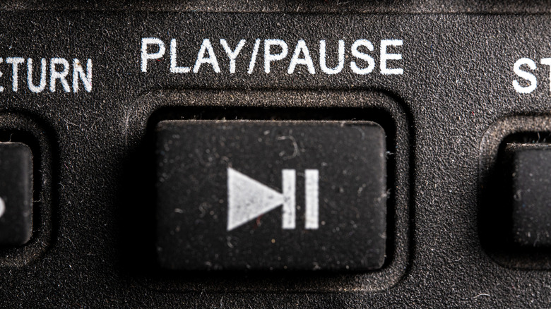 Play/Pause button on an old remote control