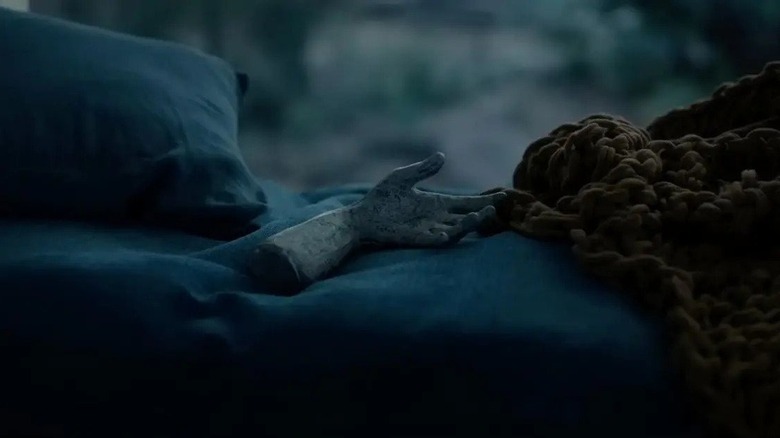 Talk To Me hand lying on blanket