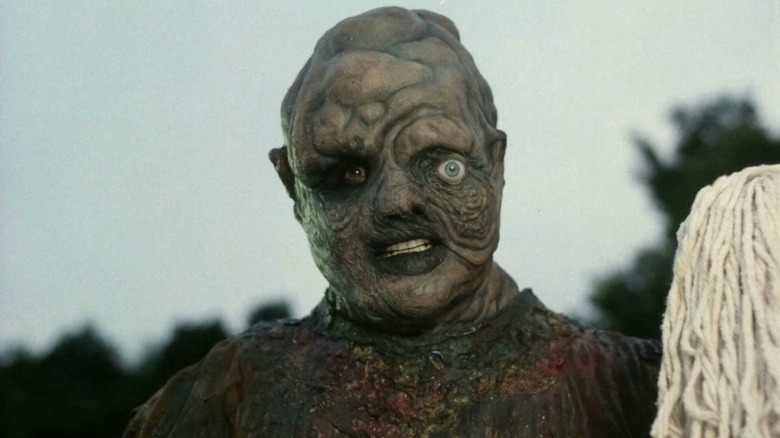 The Toxic Avenger (Mitch Cohen) stands with his mop in The Toxic Avenger (1984)