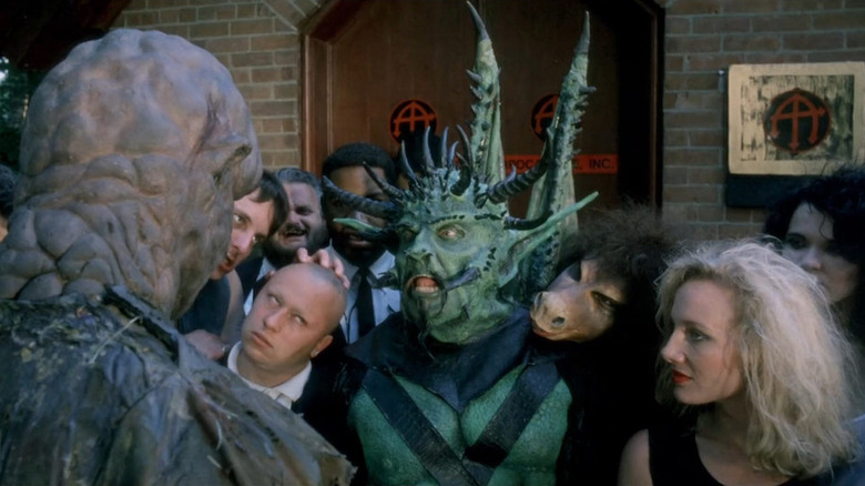 The Toxic Avenger (John Altamura) confronts the Devil (Rick Collins) and his thralls in The Toxic Avenger Part III: The Last Temptation of Toxie