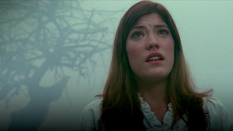 Emily Stands Outside in the Fog