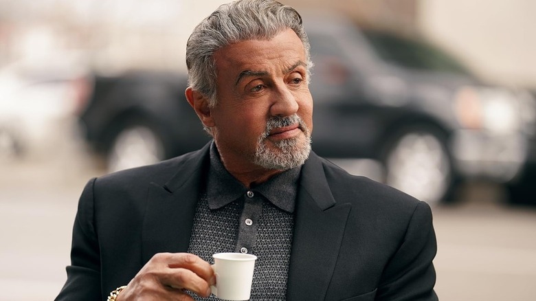 Sylvester Stallone's Dwight Manfredi holds a small coffee cup on Tulsa King