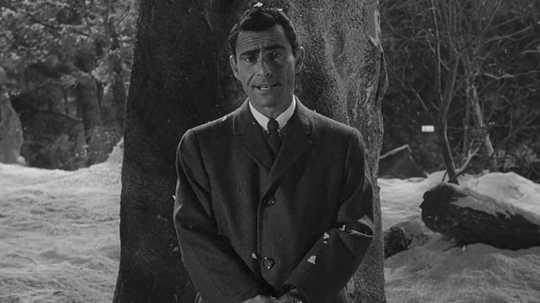 Rod Serling in the Twilight Zone standing in front of tree during winter