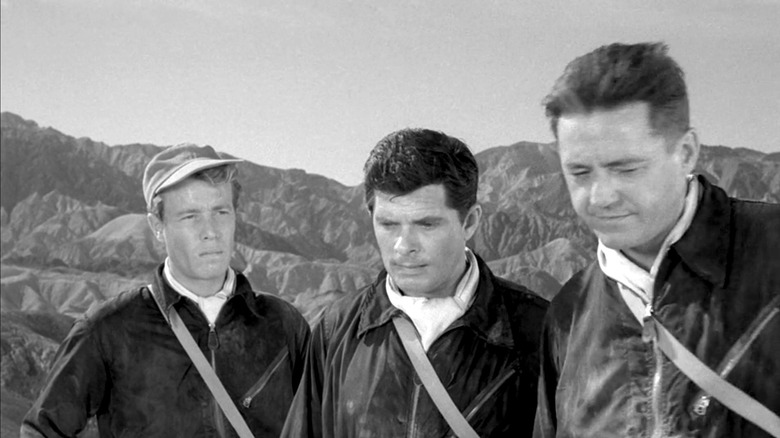 The Twilight Zone, Donlin, Corey, and Pierson standing side by side, in the desert