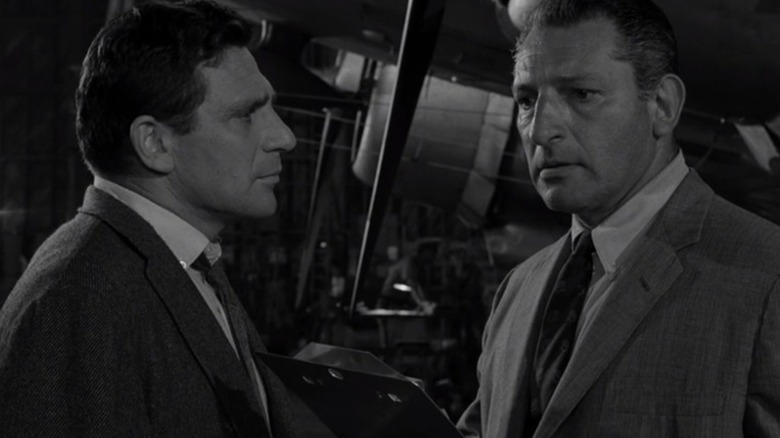 Sheckly hallucinates a conversation with a coworker in the Twilight Zone episode The Arrival